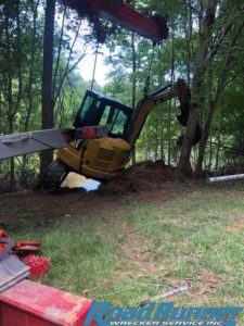 Heavy towing recovery of an excavator