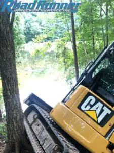 Heavy towing recovery of an excavator