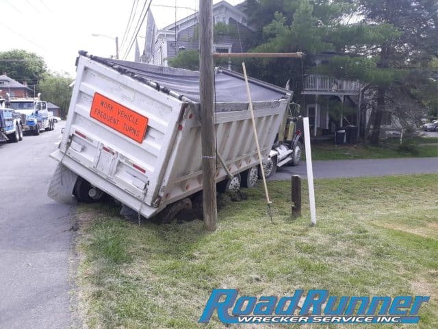 Heavy Duty Towing Team Gets Dump Truck Out of a Tricky Situation